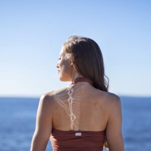 Through the trapezius